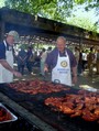 Clancy Duppong and Carl Rodegerdts tend to the chicken